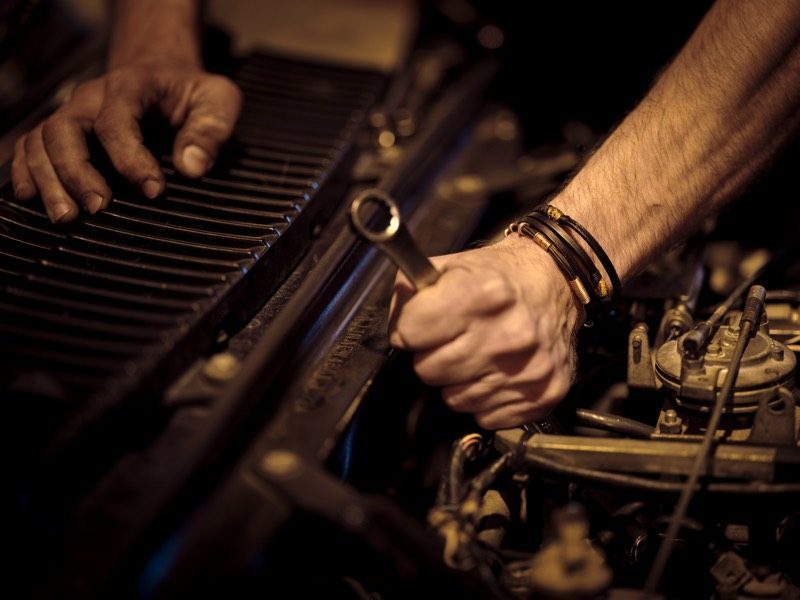 Mechanic using a wrench during engine maintenance